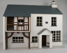 Wooden Farmhouse dolls house with six windows, balcony and porch,