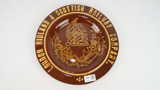 Earthenware plate slipware decorated London Midland & Scottish Railway around Rose & Thistle,