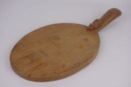 'Mouseman' oval cheese board handle, by Robert Thompson of Kilburn,