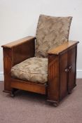 Art Deco oak framed reclining armchair fitted with double cupboard enclosing drinks holders and