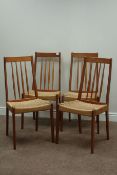 Set four Danish style teak dining chairs with rush seats and a 'Meredew' teak extending dining