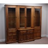 Ercol 'Mural' golden dawn finish elm three section wall unit with glazed and panelled doors, W223cm,