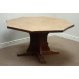 'Mouseman' adzed oak octagonal concave dining table, on cruciform base, D149cm,
