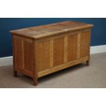 'Acornman' adzed oak four panelled blanket box, with hinged lid, by Alan Granger of Brandsby,