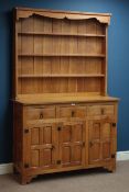 'Squirrelman' oak panelled three drawer, three cupboard dresser, with three tier plate rack, W120cm,