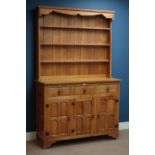 'Squirrelman' oak panelled three drawer, three cupboard dresser, with three tier plate rack, W120cm,