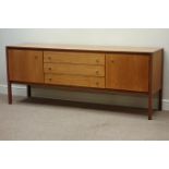 Heals of London teak sideboard, two cupboards, three drawers, with brass ring handles, W183cm,