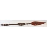 African wooden paddle with carved and pieced decoration,