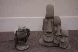 Composite stone 'Easter Island heads' garden ornament and a composite stone barn owl figure