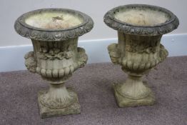 Pair composite stone garden urns, egg and dart rim decoration, with moulded gargoyles and flowers,