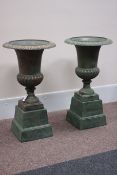 Pair Victorian style copper finish cast iron urns on plinths, D47cm,