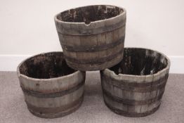 Three oak and metal bound whiskey barrel planters Condition Report <a