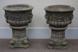 Pair composite stone garden urns on stands with lion motif, D54cm,
