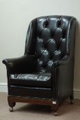 20th century oak framed wingback armchair,