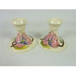 Pair of Moorcroft cream ground Clematis pattern candlesticks (2) Condition Report