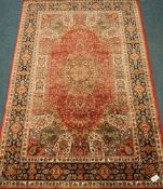 Persian design red ground rug, central rosette, floral design,