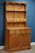 Polished pine two drawer dresser with cupboard, raised plate rack with spice drawers, W98cm, H189cm,