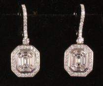 Pair of baguette and round diamond cluster drop ear-rings stamped 750 Condition Report