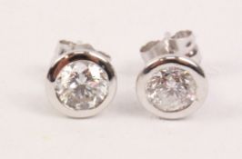 Pair of diamond ear-rings white gold surrounds stamped 750 approx 1.