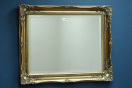 Gilt framed bevelled edge wall mirror,