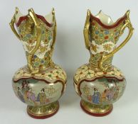 Pair of Japanese Satsuma pottery vases, painted with figures in panels with gilt handles,