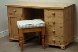 Waxed pine twin pedestal dressing table/desk, five drawers and single cupboard, with stool, W130cm,