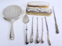 Hallmarked silver backed dressing table items,