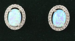 Pair of halo set opal dress ear-rings stamped 925 Condition Report <a