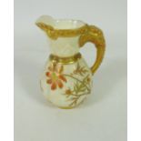 Small Royal Worcester jug with gilt elephant handle ivory ground H8.