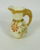 Small Royal Worcester jug with gilt elephant handle ivory ground H8.