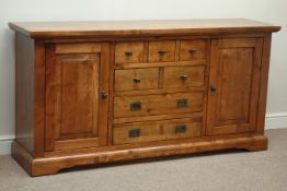 Stained chestnut wood sideboard, panelled cupboards, four central drawers, W170cm, H85cm,