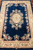Chinese washed woollen blue ground rug,