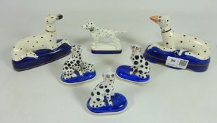 Pair of porcelain Dalmatian dog figures and a similar model, marked with gold anchors on base,