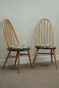 Two Ercol Windsor light elm stick and hoop back chairs,