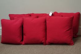Eight red cover traditional duck feather lined cushions,
