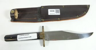 Venture Bowie knife with horn type handle, brass guard and steel blade,