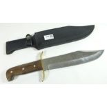 Bowie knife with wooden grip, brass guard and steel blade in leather sheath,