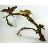 Cold painted bronze model of a pair of pheasants on a branch,
