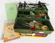 Cantilever tackle box containing fly tying equipment including vice etc and four books relating to