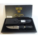 Fallkniven Swedish knife, rubber grip with steel blade and leather sheath, in presentation box,