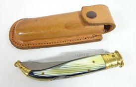 Folding knife with brass and horn type handle, steel blade engraved Albacete, in leather sheath,