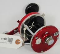 ABU Ambassadeur 9000 automatic two-speed fishing reel with red anodised case and black knob