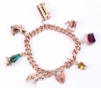Rose gold curb chain bracelet stamped 9c with seven hallmarked 9ct gold charms approx 42.