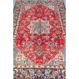 Persian Tabriz red ground, floral design with central medallion,