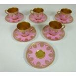 Set of five Royal Worcester pink ground jewelled coffee cups & saucers, with additional saucer,