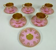 Set of five Royal Worcester pink ground jewelled coffee cups & saucers, with additional saucer,