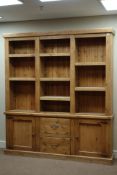 Large rustic pine bookcase, adjustable shelves above two drawers and two cupboards, W176cm, H199cm,