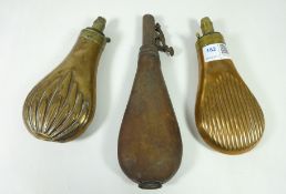 Two 19th Century copper powder flasks and a 19th Century leather power flask (3)