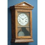 Early 20th century oak clock, dial signed 'Recorders Ltd' architectural case with visible pendulum,