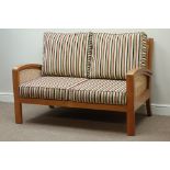 Walnut framed two seat bergere sofa with loose cushions upholstered in striped fabric,